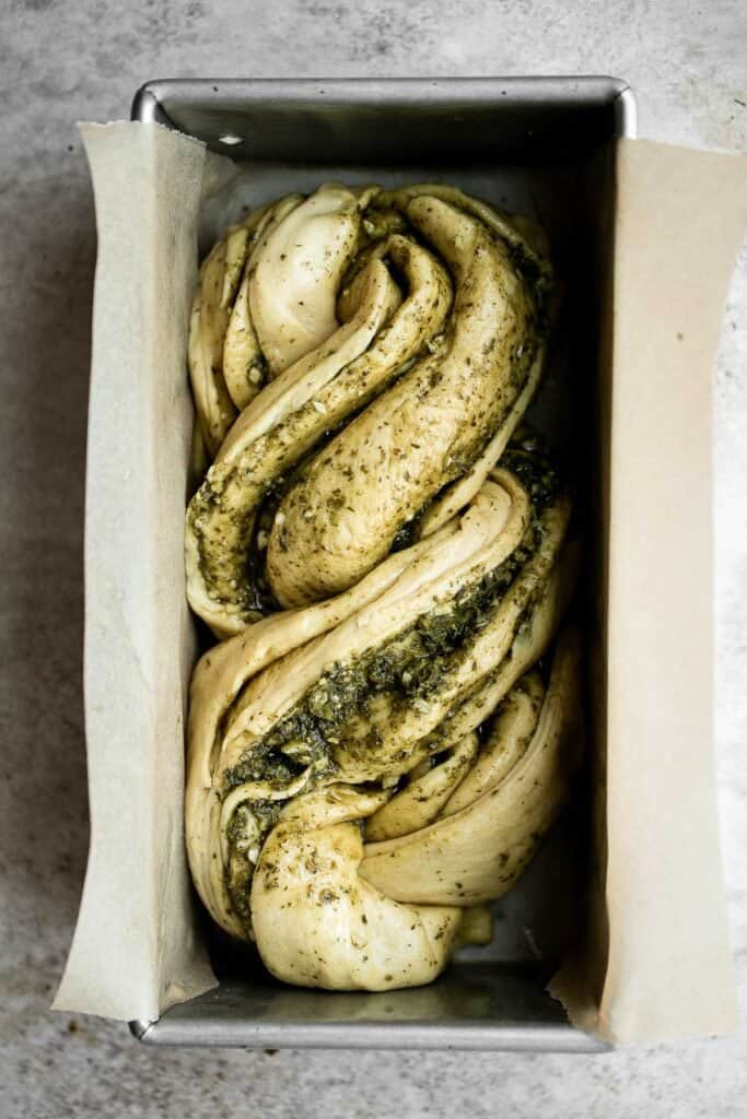 Pesto babka is a showstopping loaf of bread that is savory, delicious, and flavorful with beautiful twists and turns. Plus, it is surprisingly easy to make! | aheadofthyme.com