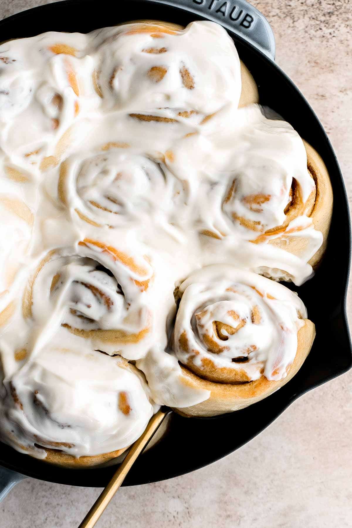 Soft and fluffy skillet cinnamon rolls are filled with classic cinnamon sugar and topped with homemade cream cheese icing. Sweet, buttery, and delicious. | aheadofthyme.com