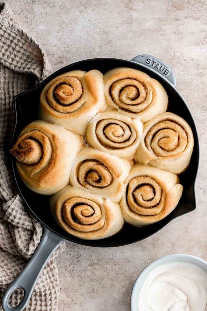 Soft and fluffy skillet cinnamon rolls are filled with classic cinnamon sugar and topped with homemade cream cheese icing. Sweet, buttery, and delicious. | aheadofthyme.com