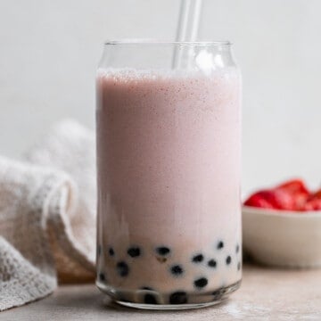 Refreshing strawberry milk tea with boba tapioca pearls is easy to make at home. Loaded with fresh fruit, homemade bubble tea is better than storebought. | aheadofthyme.com