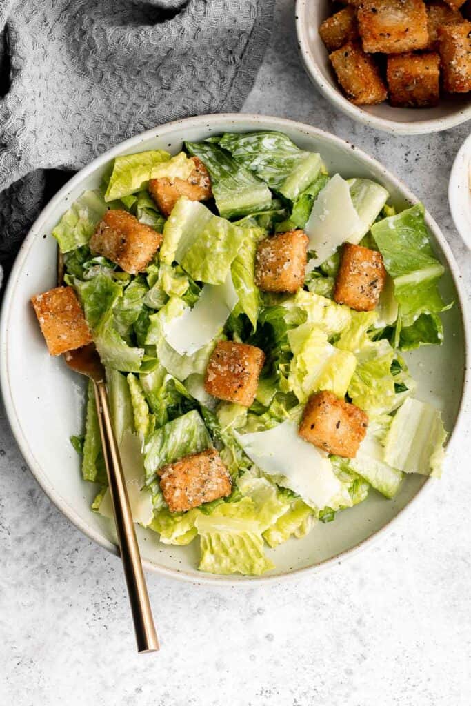 Classic Caesar Salad is fresh, crisp, delicious, and flavorful. With three simple ingredients tossed in a creamy Caesar dressing, it's ready in minutes. | aheadofthyme.com