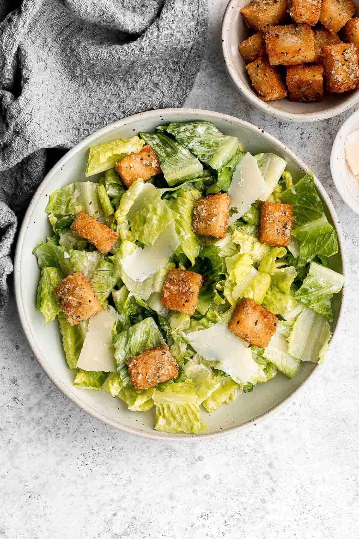 Classic Caesar Salad is fresh, crisp, delicious, and flavorful. With three simple ingredients tossed in a creamy Caesar dressing, it's ready in minutes. | aheadofthyme.com