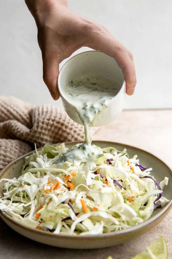 Vegetarian cauliflower tacos are loaded with air-fried or baked cauliflower, a delicious seasoning blend, and creamy lime cilantro slaw inside a tortilla. | aheadofthyme.com