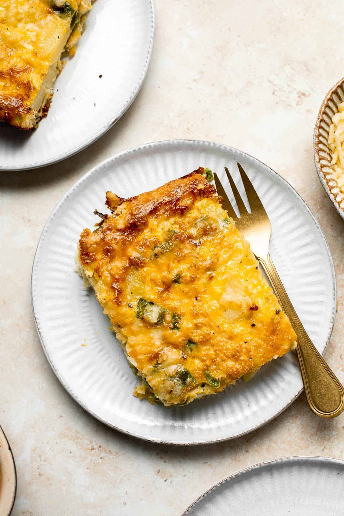 Egg and Potato Breakfast Casserole is an easy vegetarian breakfast bake loaded with veggies. It is completely customizable and can be made ahead of time. | aheadofthyme.com