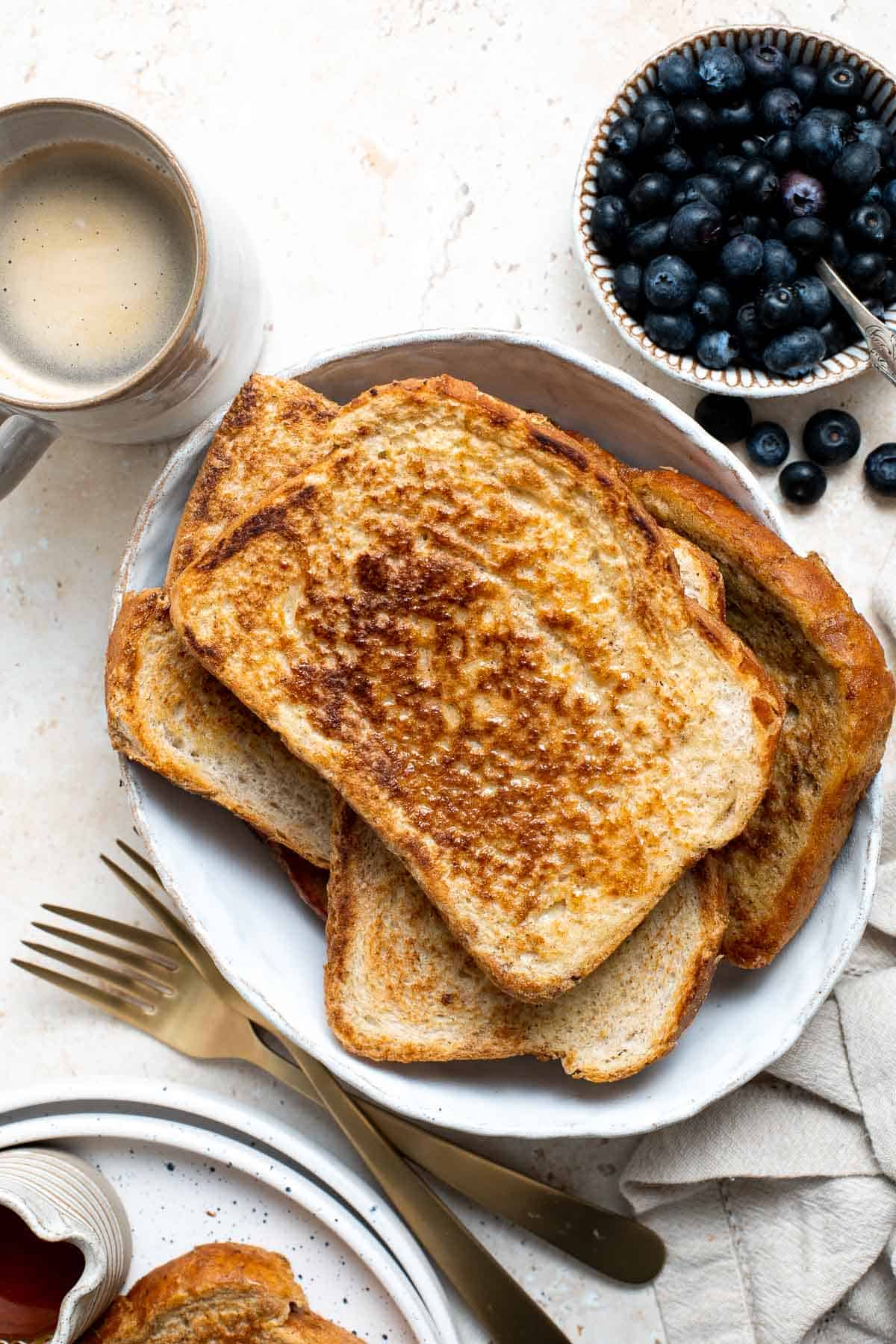 This Classic French Toast is light and fluffy, crisp and browned on the edges, and so delicious. The best part? Breakfast is ready in under 15 minutes. | aheadofthyme.com