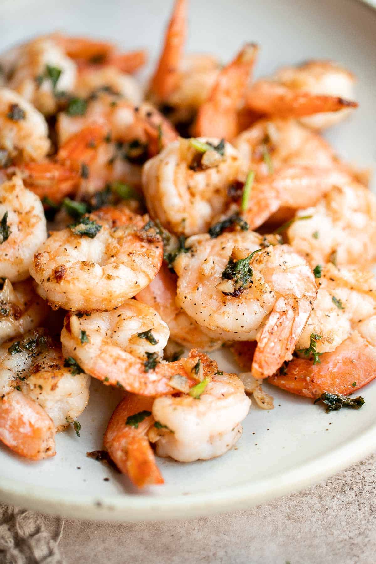 Garlic butter shrimp is a quick and easy dinner ready in just 10 minutes! It’s loaded with flavor and perfect for busy weeknights and special occasions. | aheadofthyme.com