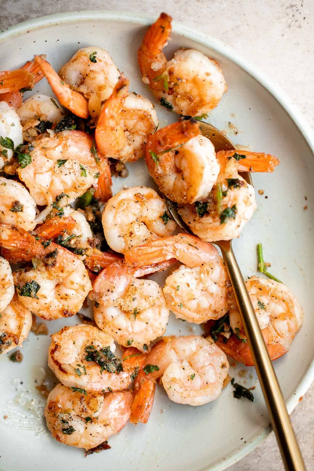 Garlic butter shrimp is a quick and easy dinner ready in just 10 minutes! It’s loaded with flavor and perfect for busy weeknights and special occasions. | aheadofthyme.com