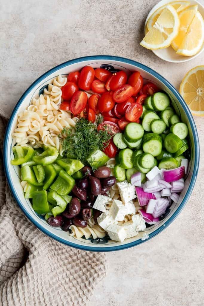 Greek Pasta Salad is quick and easy, loaded with Mediterranean flavors, and delicious. Serve it at a summer cookout or potluck, or meal prep weekly lunches. | aheadofthyme.com
