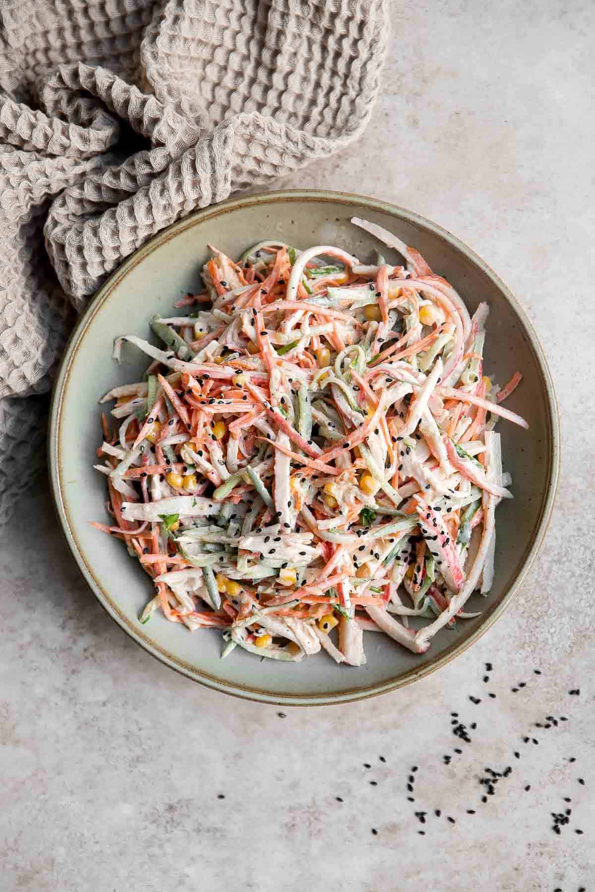 Kani Salad is loaded with thin strips of crab, julienned vegetables, and a creamy mayo dressing (which can be made spicy for a Spicy Kani Salad). | aheadofthyme.com