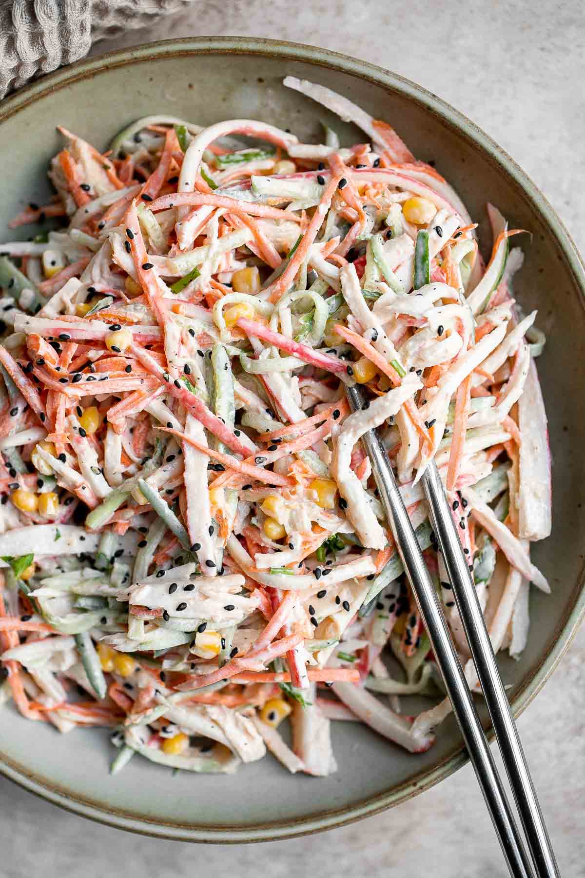 Kani Salad is loaded with thin strips of crab, julienned vegetables, and a creamy mayo dressing (which can be made spicy for a Spicy Kani Salad). | aheadofthyme.com