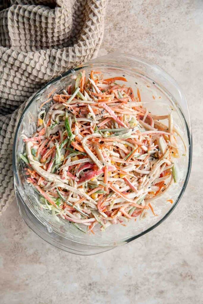 Kani Salad is loaded with thin strips of crab, julienned vegetables, and a creamy mayo dressing (which can be made spicy for a Spicy Kani Salad). | aheadofthyme.com