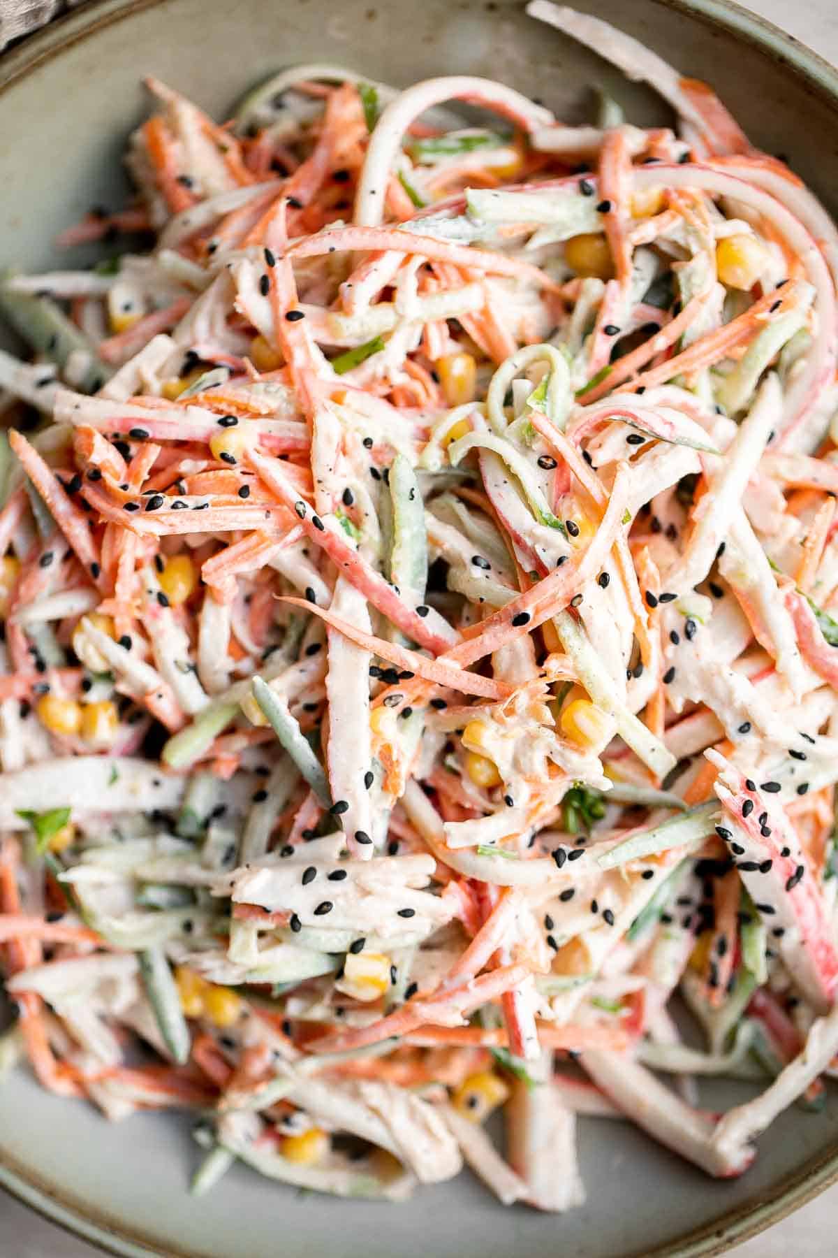 Kani Salad is loaded with thin strips of crab, julienned vegetables, and a creamy mayo dressing (which can be made spicy for a Spicy Kani Salad). | aheadofthyme.com