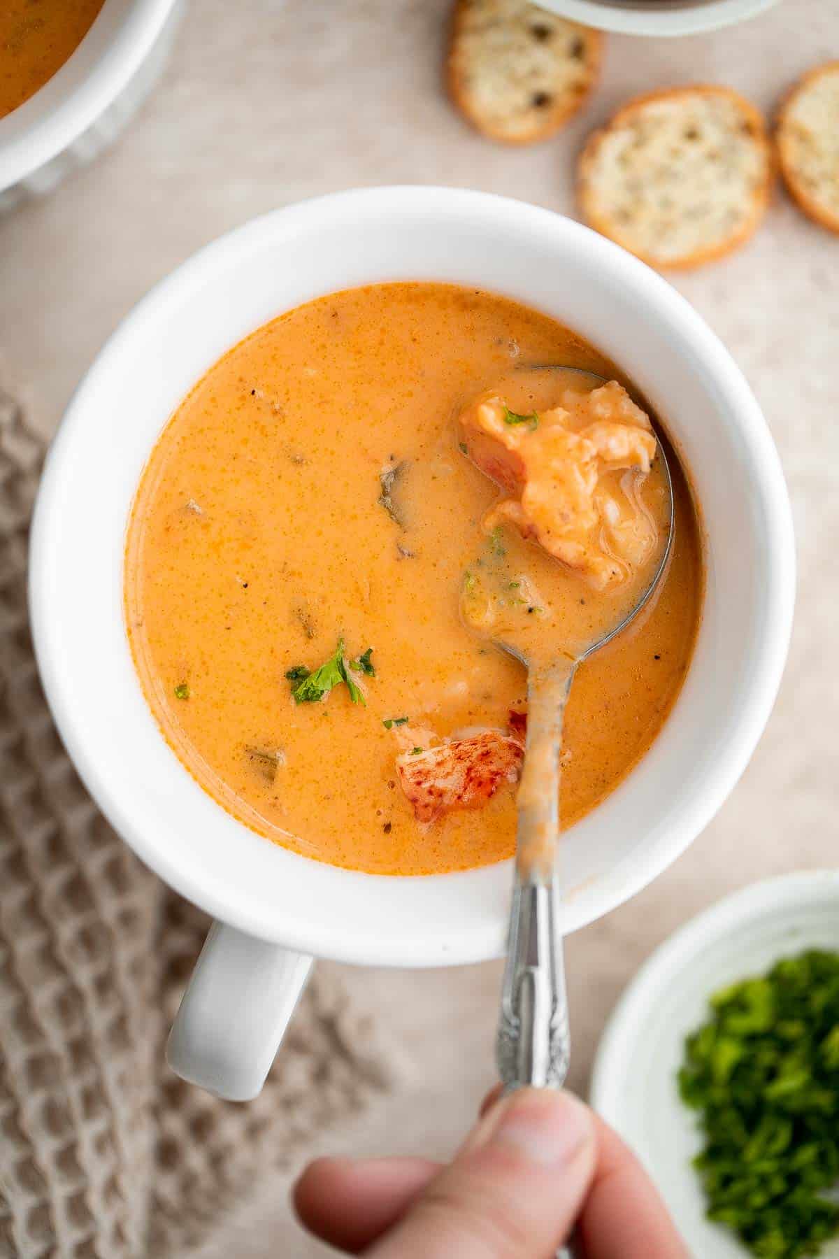 Homemade lobster bisque is rich and creamy, loaded with seafood flavor, and delicious. Serve this quick and easy soup with soft bread for lunch or dinner. | aheadofthyme.com