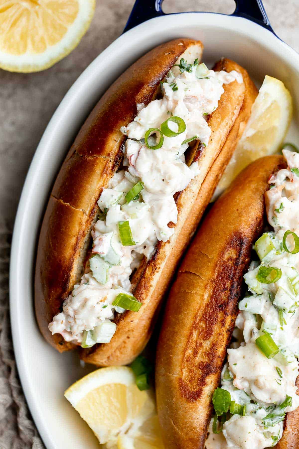 New England Lobster Rolls are a classic sandwich loaded with fresh lobster meat. Make them in just 10 minutes and serve them all summer long. | aheadofthyme.com