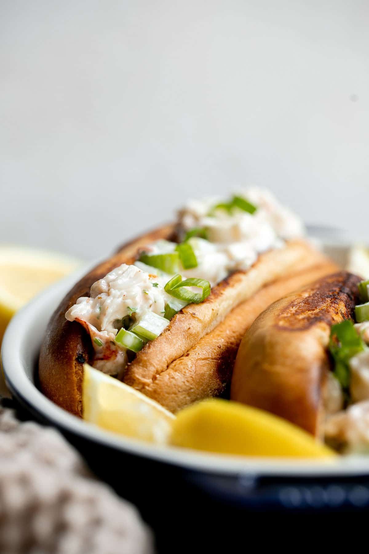 New England Lobster Rolls are a classic sandwich loaded with fresh lobster meat. Make them in just 10 minutes and serve them all summer long. | aheadofthyme.com