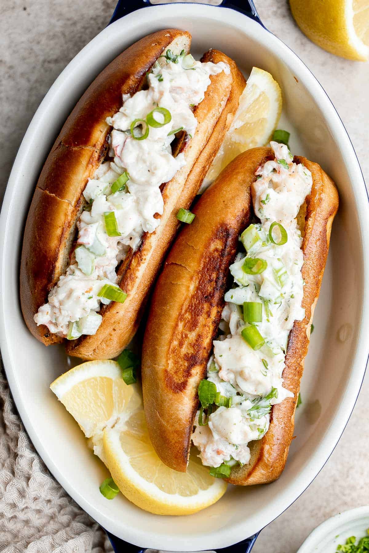 New England Lobster Rolls are a classic sandwich loaded with fresh lobster meat. Make them in just 10 minutes and serve them all summer long. | aheadofthyme.com