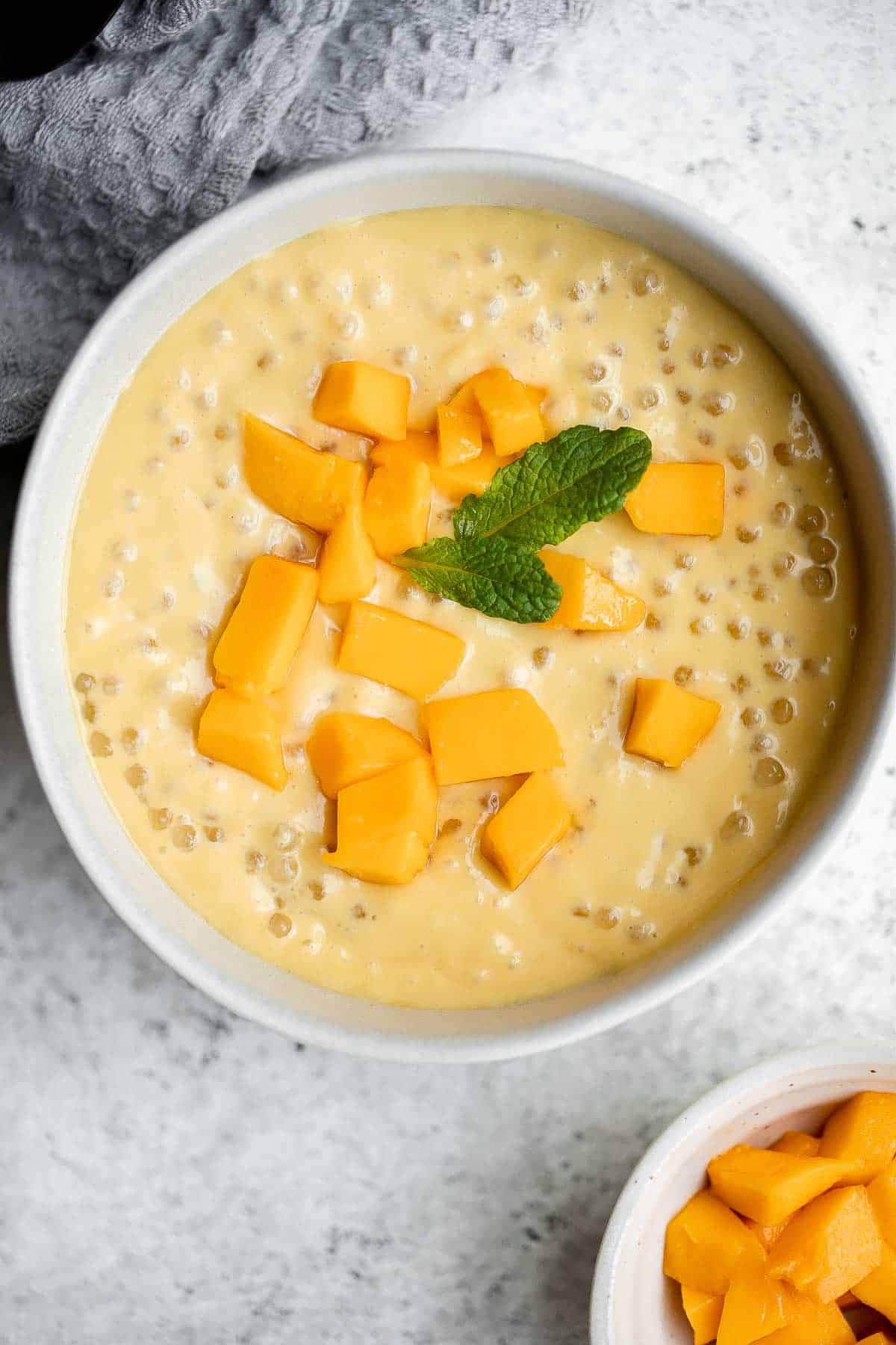 Mango sago is a popular Asian dessert that’s creamy, fruity, cold tapioca pudding dessert is easy to make at home with just a few simple ingredients. | aheadofthyme.com