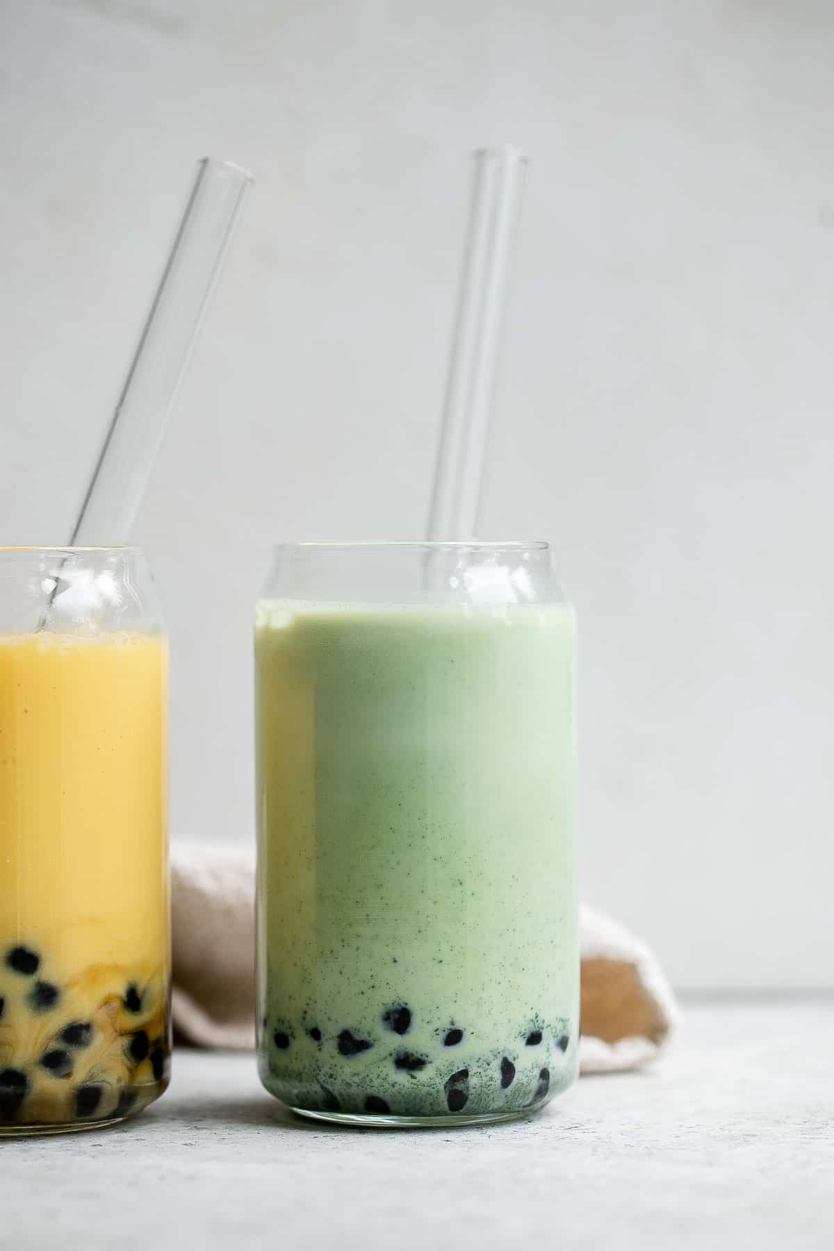 Iced Matcha Milk Tea with boba tapioca pearls is rich, refreshing, and delicious. Made with 3 ingredients, matcha bubble tea is easy to make at home. | aheadofthyme.com