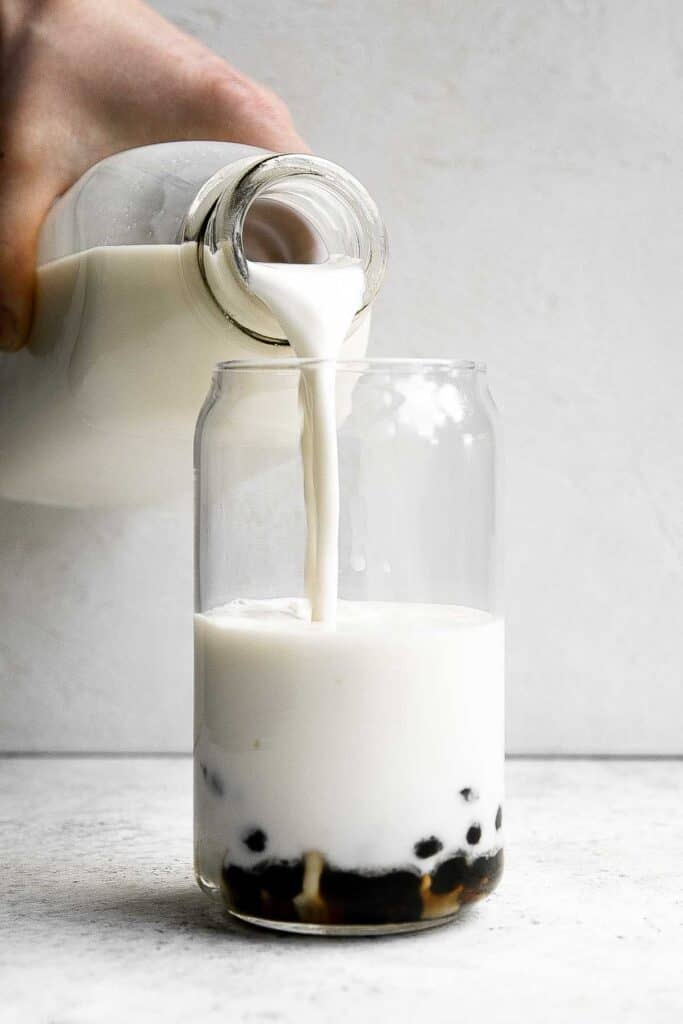 Iced Matcha Milk Tea with boba tapioca pearls is rich, refreshing, and delicious. Made with 3 ingredients, matcha bubble tea is easy to make at home. | aheadofthyme.com