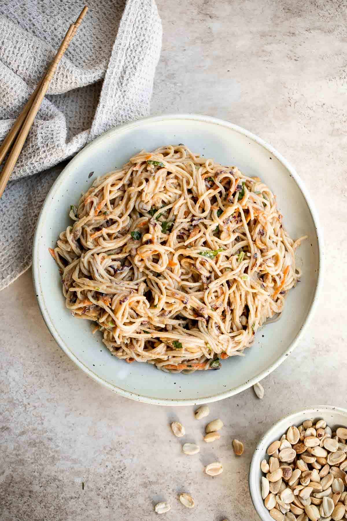 Peanut noodles are creamy, nutty, and delicious. This quick and easy, vegan homemade takeout recipe is loaded with flavor and is ready in 15 minutes. | aheadofthyme.com