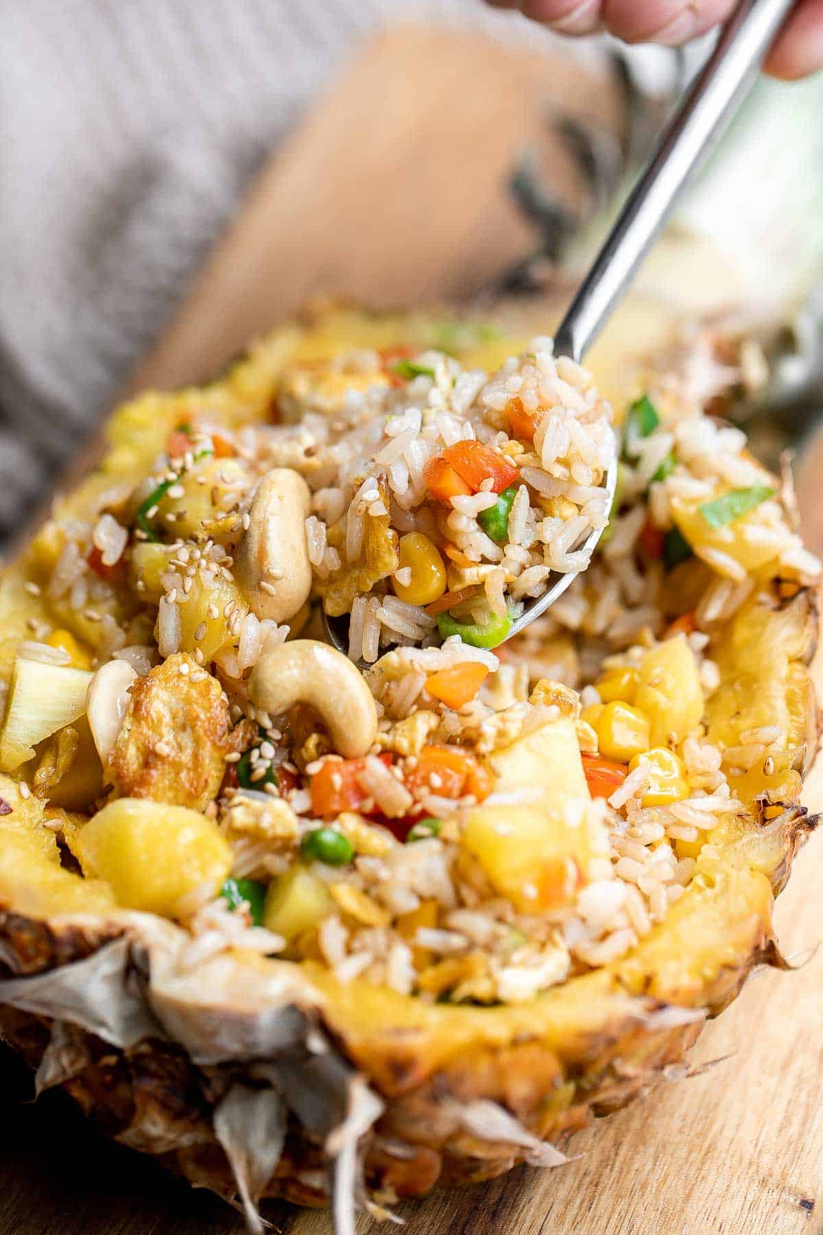 Pineapple fried rice is a quick and easy meal that is ready in just 20 minutes. It's a savory, sweet, delicious, and flavorful weeknight family dinner. | aheadofthyme.com