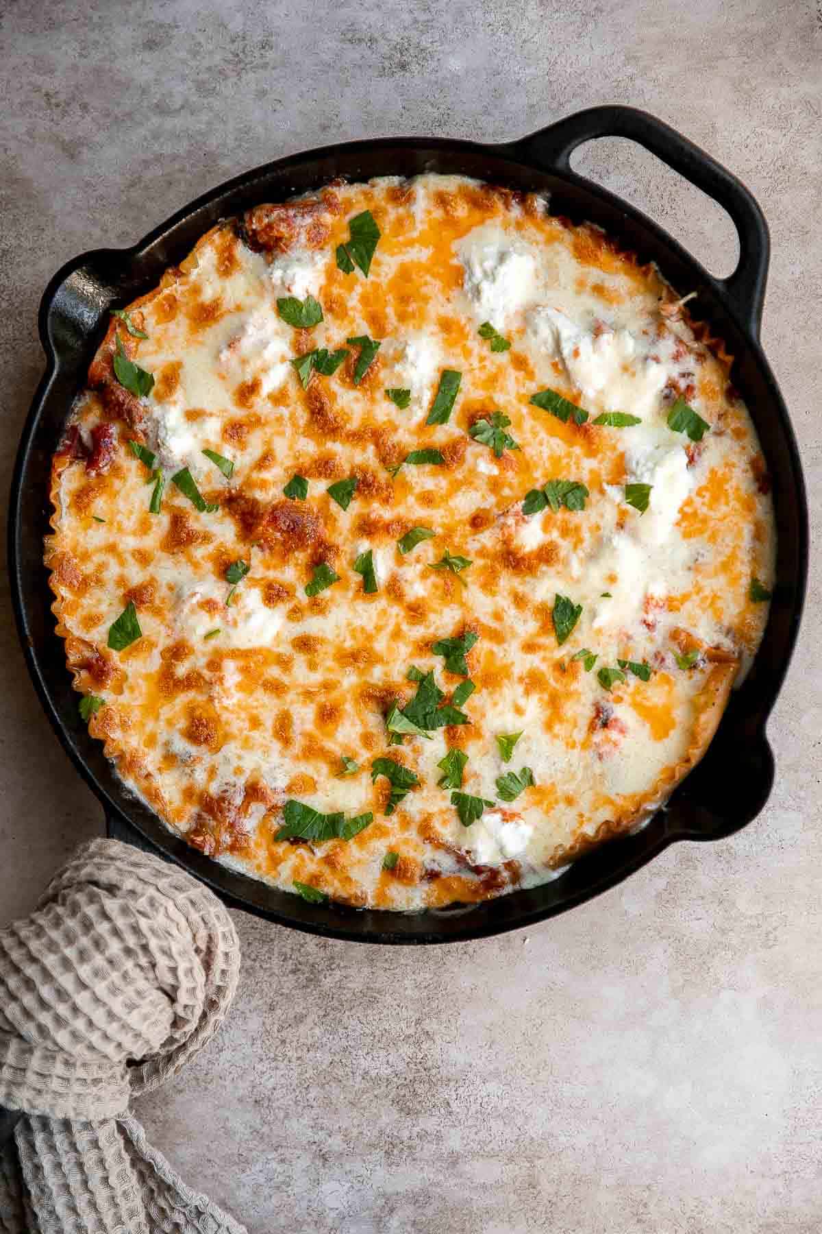 This one pan Skillet Lasagna has all the same ingredients and flavors as a traditional meat lasagna but with minimal prep and is ready in just 40 minutes. | aheadofthyme.com