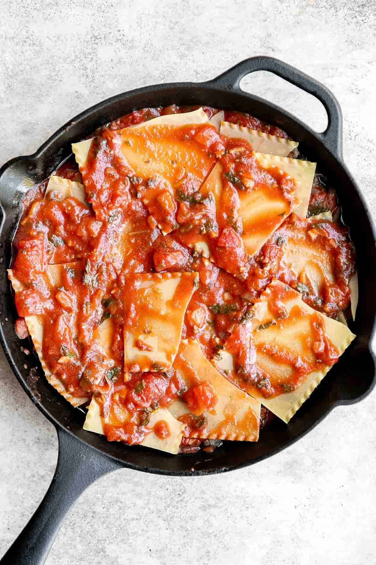 This one pan Skillet Lasagna has all the same ingredients and flavors as a traditional meat lasagna but with minimal prep and is ready in just 40 minutes. | aheadofthyme.com