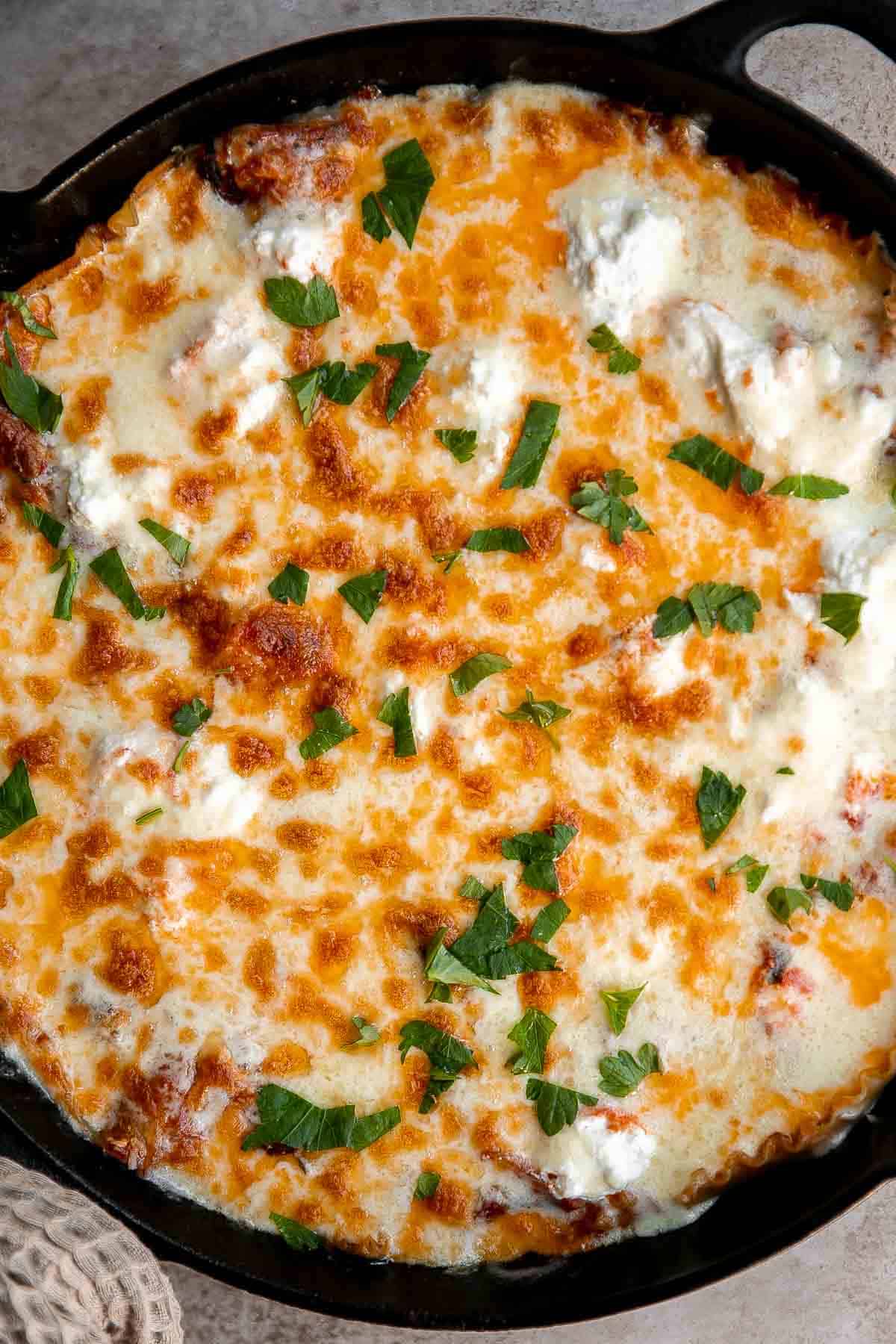 This one pan Skillet Lasagna has all the same ingredients and flavors as a traditional meat lasagna but with minimal prep and is ready in just 40 minutes. | aheadofthyme.com