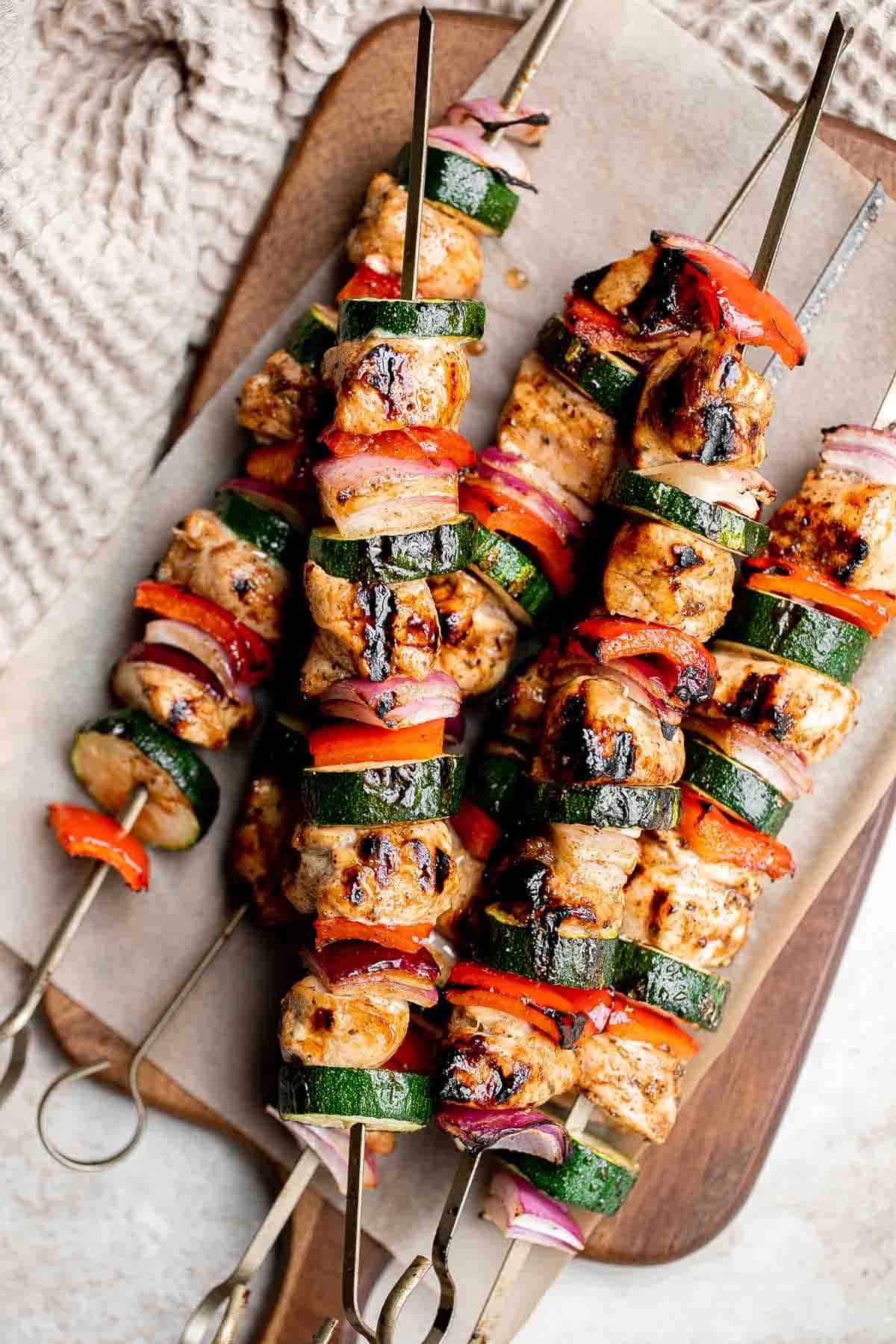 Grilled Balsamic Chicken Kabobs are a delicious flavorful summer grill staple marinated in a balsamic sauce, skewered with vegetables, and grilled or baked. | aheadofthyme.com