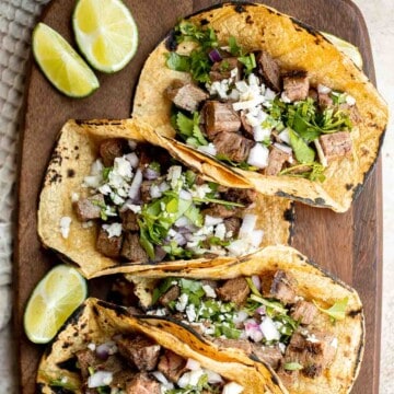 Carne asada tacos are delicious, juicy, and tender Mexican street tacos loaded with steak bites that everyone will be raving about on Taco Tuesday! | aheadofthyme.com