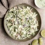 Cilantro lime slaw is fresh, light, crunchy, and zesty. Ready in 5 minutes, it’s the perfect pairing for tacos, burgers, sandwiches, and barbecued meats. | aheadofthyme.com