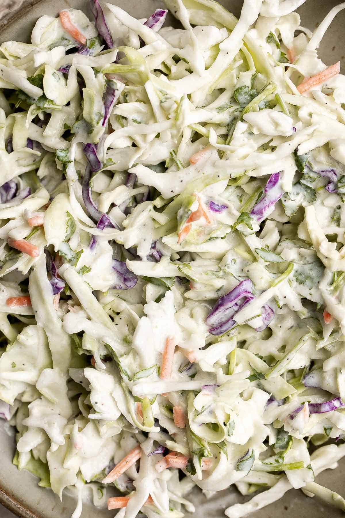 Cilantro lime slaw is fresh, light, crunchy, and zesty. Ready in 5 minutes, it’s the perfect pairing for tacos, burgers, sandwiches, and barbecued meats. | aheadofthyme.com