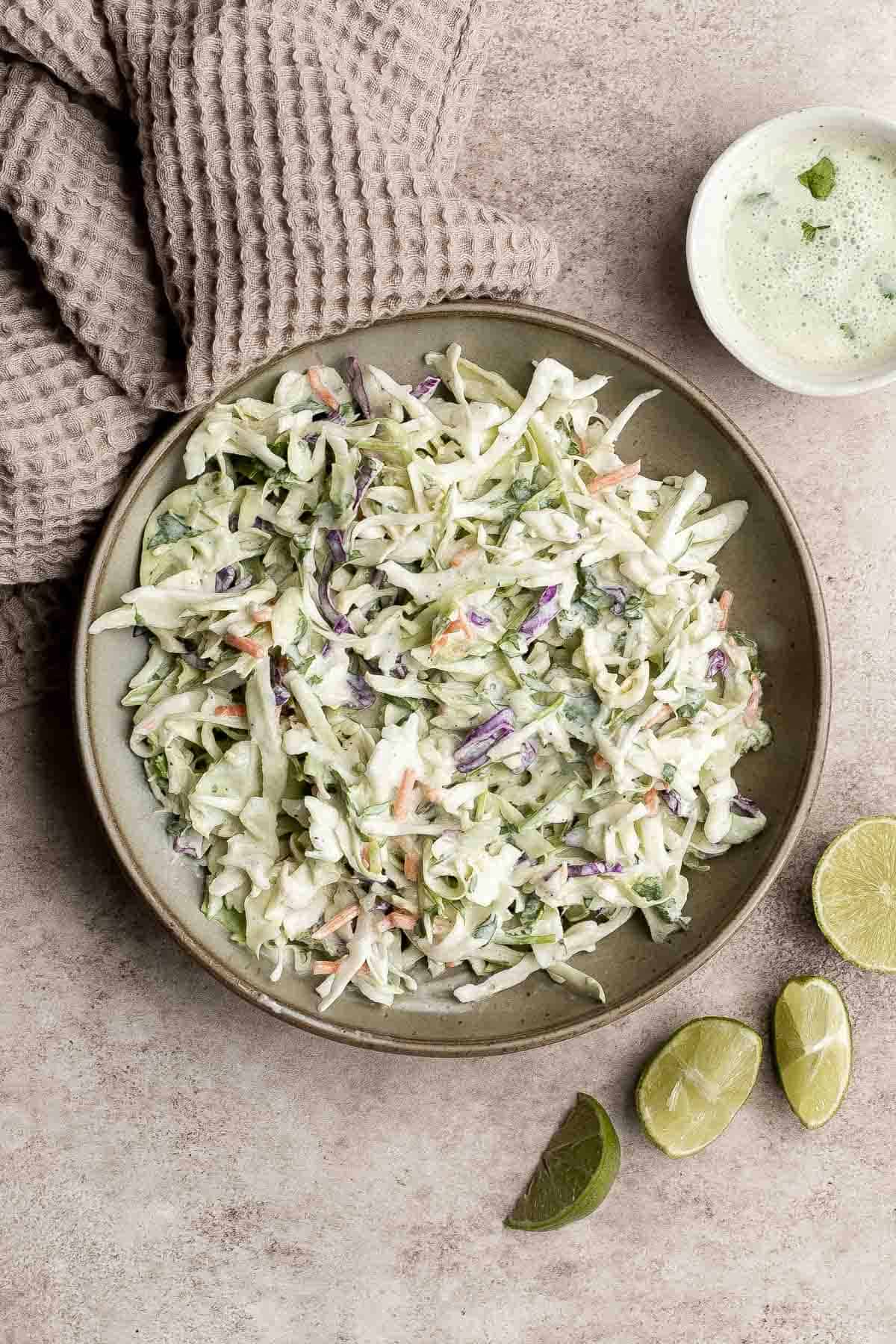 Cilantro lime slaw is fresh, light, crunchy, and zesty. Ready in 5 minutes, it’s the perfect pairing for tacos, burgers, sandwiches, and barbecued meats. | aheadofthyme.com