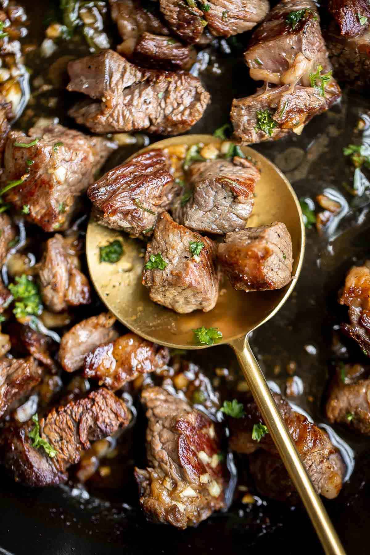 Garlic Butter Steak Bites are tender, juicy, and flavorful. This quick and easy appetizer or weeknight dinner takes just 15 minutes to make in one skillet. | aheadofthyme.com