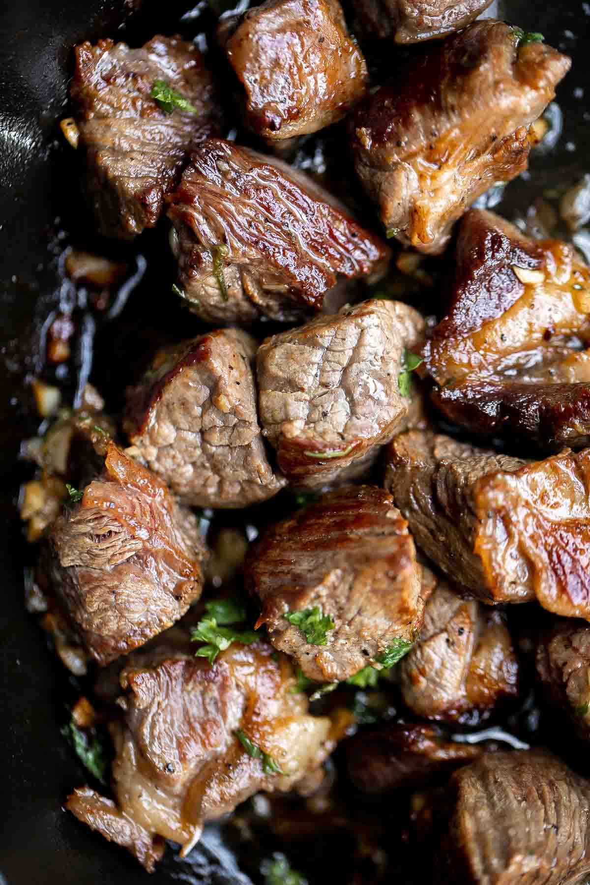 Garlic Butter Steak Bites are tender, juicy, and flavorful. This quick and easy appetizer or weeknight dinner takes just 15 minutes to make in one skillet. | aheadofthyme.com