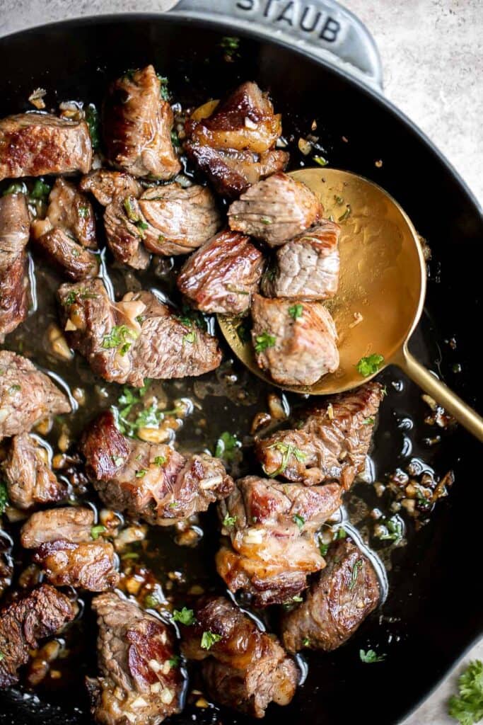 Garlic Butter Steak Bites are tender, juicy, and flavorful. This quick and easy appetizer or weeknight dinner takes just 15 minutes to make in one skillet. | aheadofthyme.com