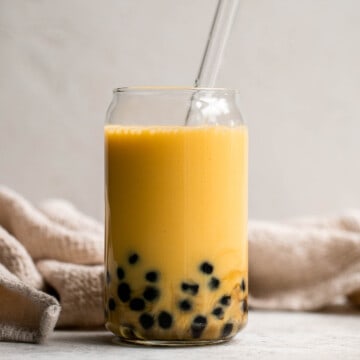 Mango Bubble Tea with boba tapioca pearls is the perfect creamy and refreshing summer drink. You won’t believe how easy and cheaper it is to make at home! | aheadofthyme.com