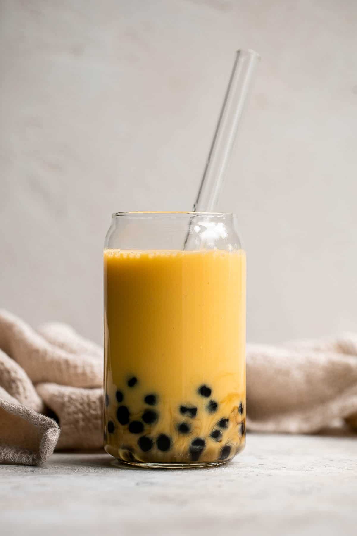 Mango Bubble Tea with boba tapioca pearls is the perfect creamy and refreshing summer drink. You won’t believe how easy and cheaper it is to make at home! | aheadofthyme.com