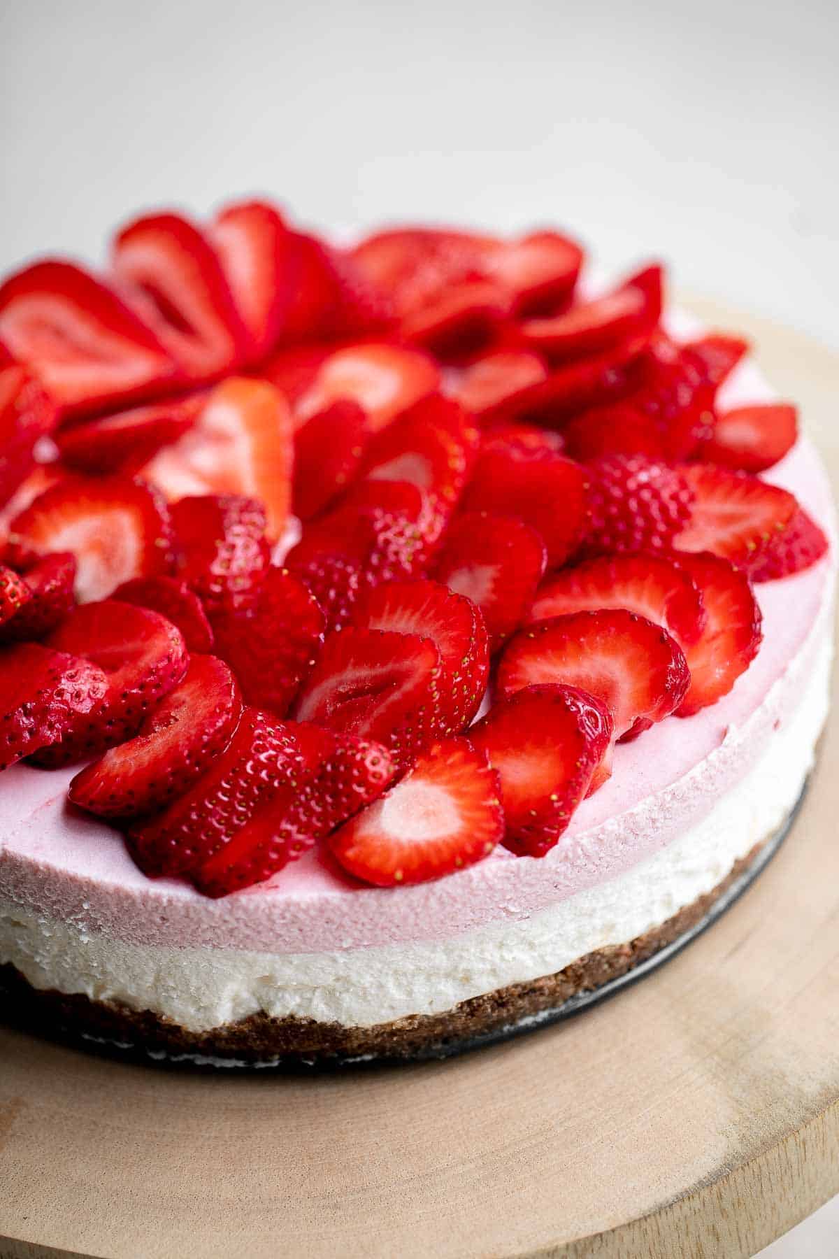 No Bake Strawberry Cheesecake is light, smooth, and creamy. This easy mousse cheesecake is made with a cheesecake layer and a strawberry mousse layer. | aheadofthyme.com