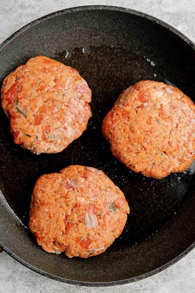 These Salmon Burgers made with real fresh salmon, are crispy on the outside and flaky inside, juicy and thick, and healthy and packed with protein. | aheadofthyme.com