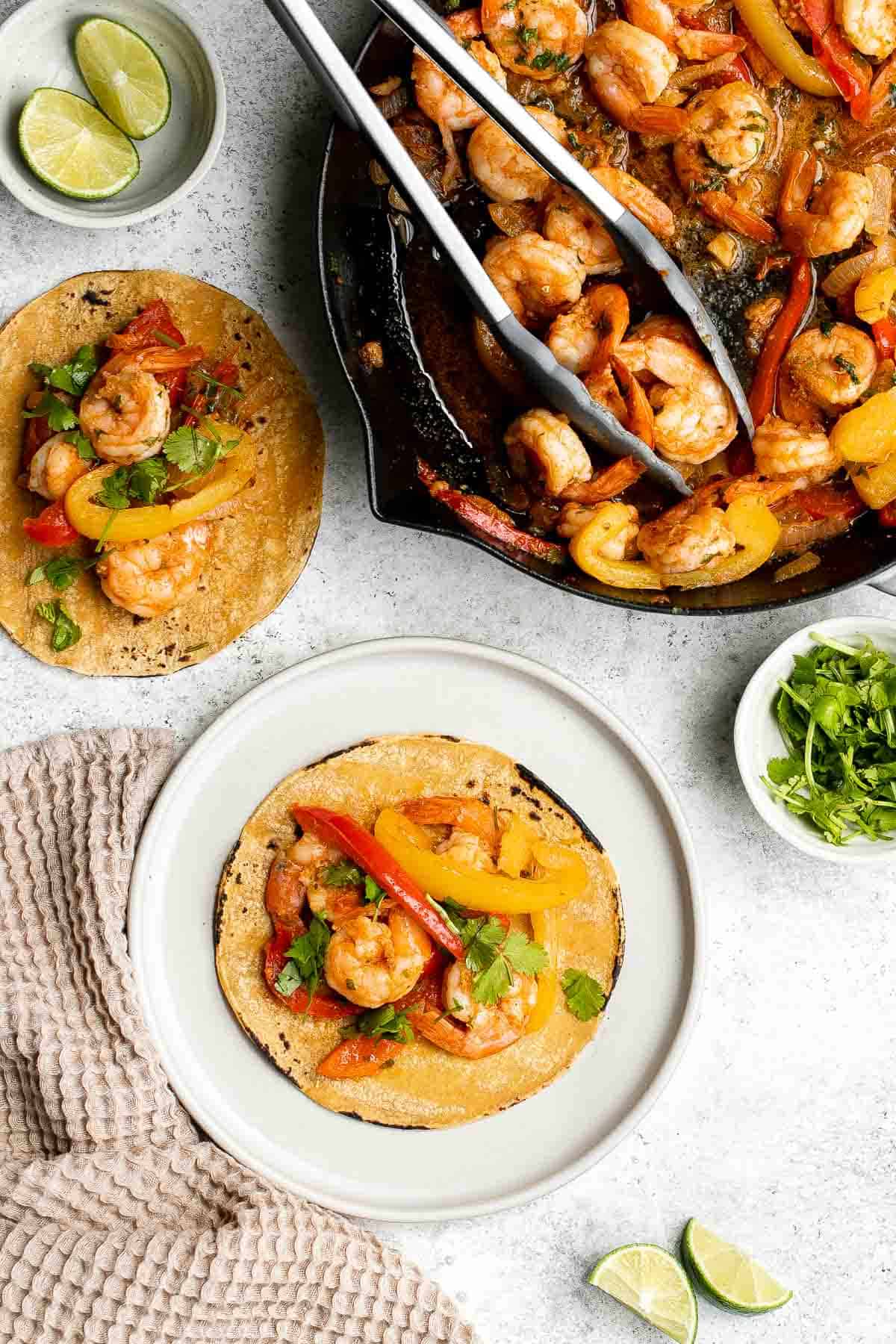 Shrimp fajitas are healthy, flavorful, and delicious. This one skillet recipe is loaded with shrimp and vegetables and is ready in just 20 minutes. | aheadofthyme.com