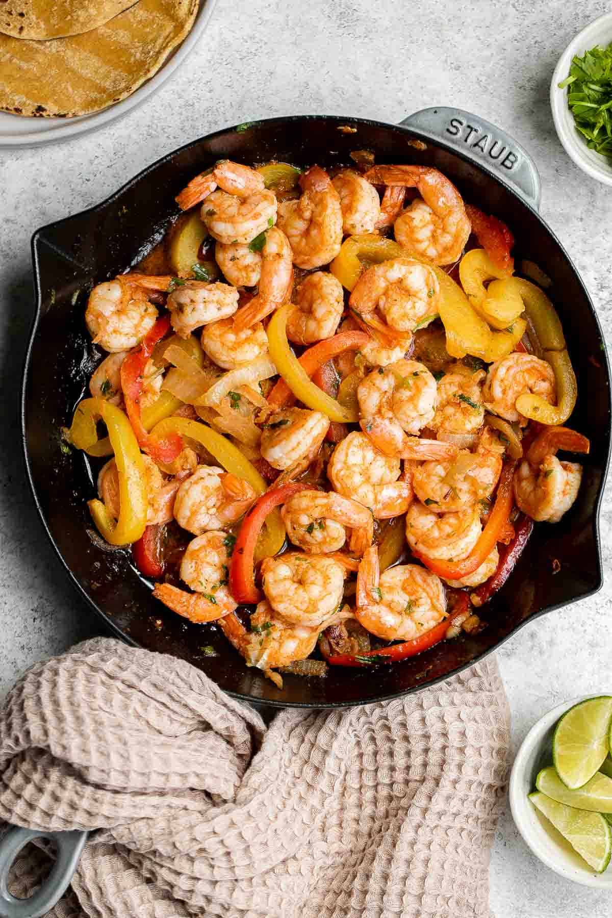 Shrimp fajitas are healthy, flavorful, and delicious. This one skillet recipe is loaded with shrimp and vegetables and is ready in just 20 minutes. | aheadofthyme.com