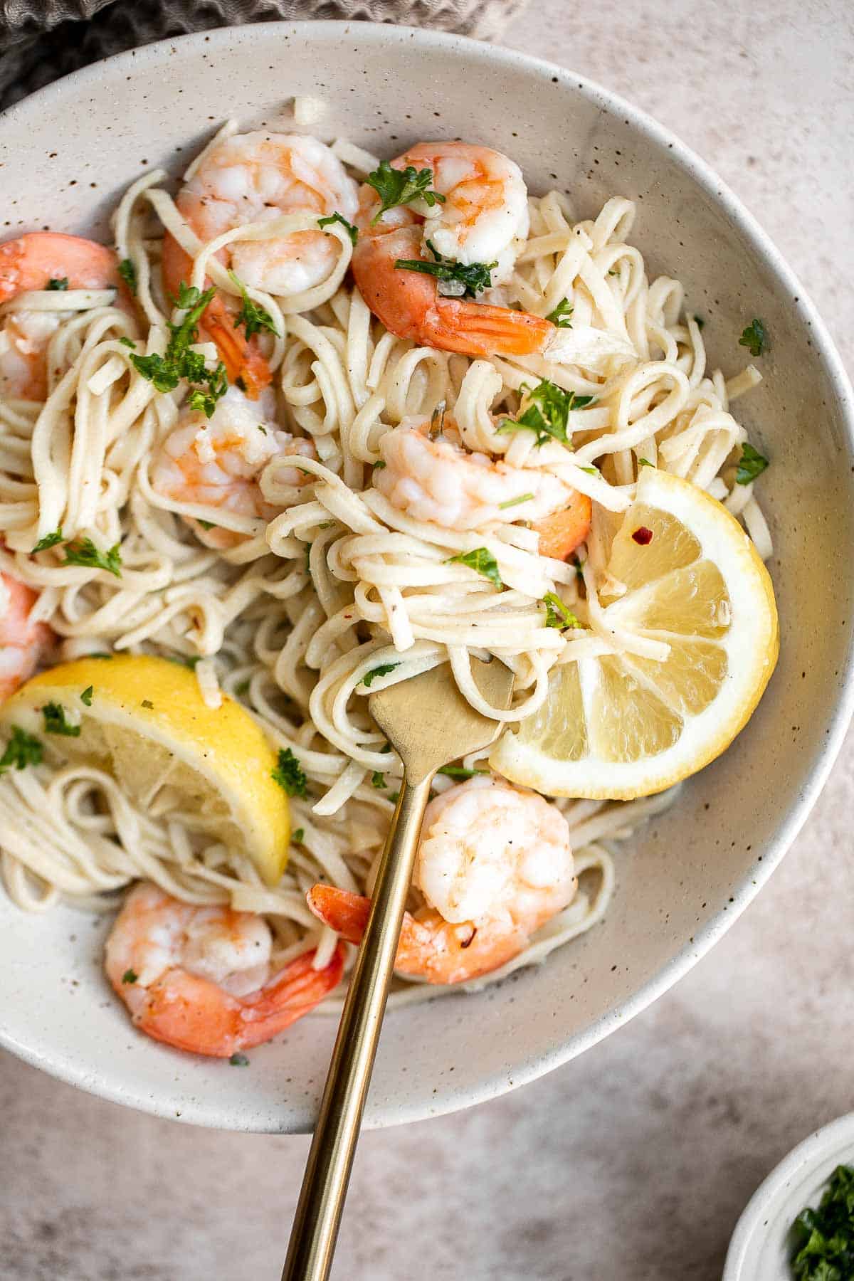 Shrimp scampi is a delicious American-Italian dish made with tender shrimp and a flavorful buttery sauce that is quick and easy to make in 15 minutes. | aheadofthyme.com