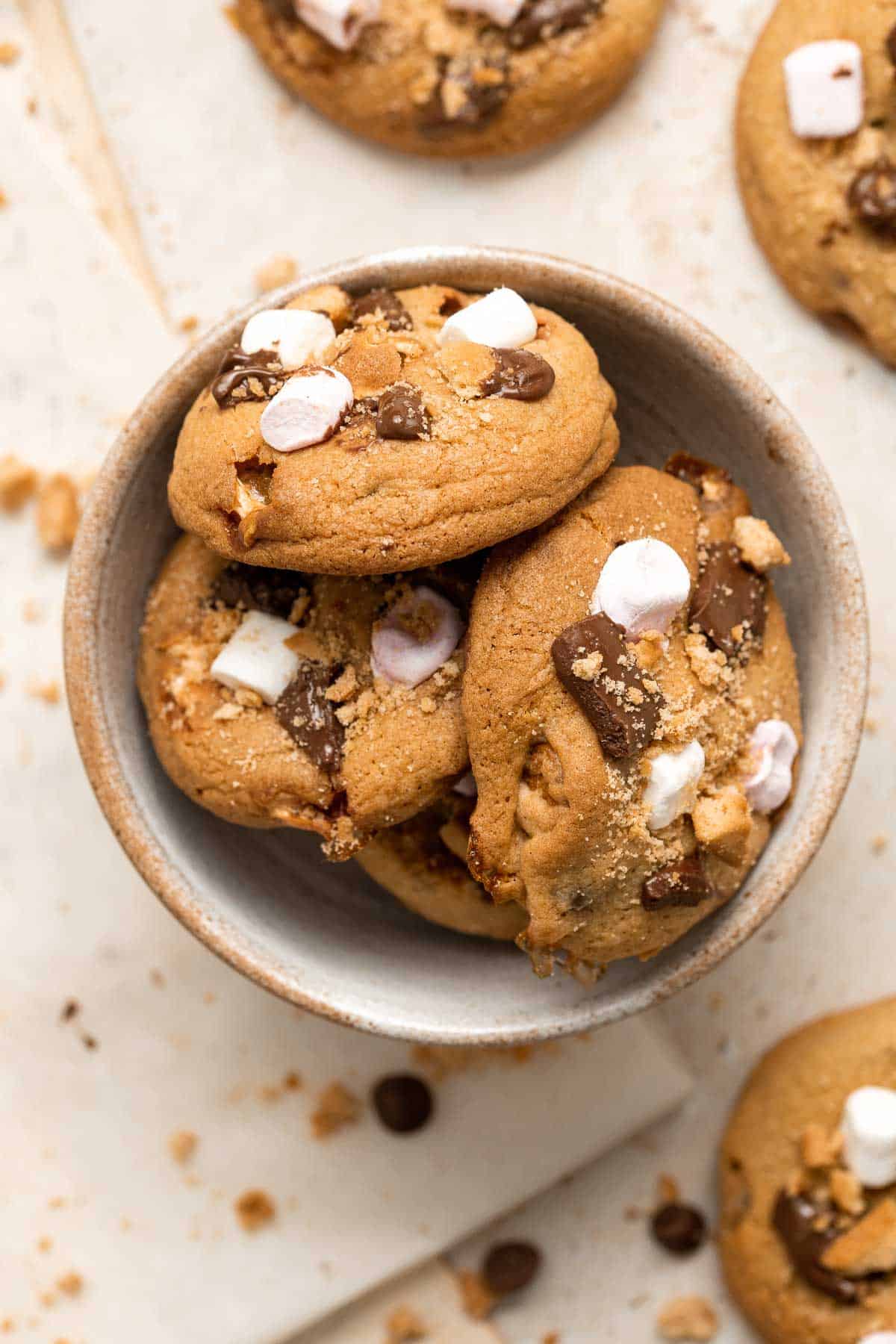S'mores Cookies are chewy, gooey, and nostalgic, loaded with marshmallows, chocolate, and Graham crackers — and no campfire required. Quick and easy too! | aheadofthyme.com
