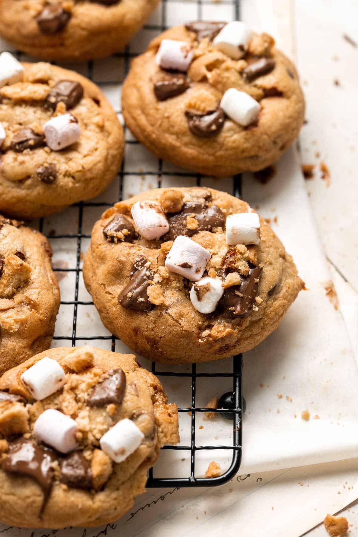 S'mores Cookies are chewy, gooey, and nostalgic, loaded with marshmallows, chocolate, and Graham crackers — and no campfire required. Quick and easy too! | aheadofthyme.com