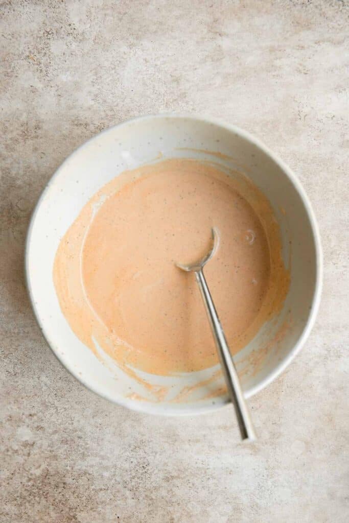 Homemade Southwest Salad Dressing is creamy and flavorful with a little spicy kick. This quick and easy yogurt-based dressing is ready in just minutes. | aheadofthyme.com