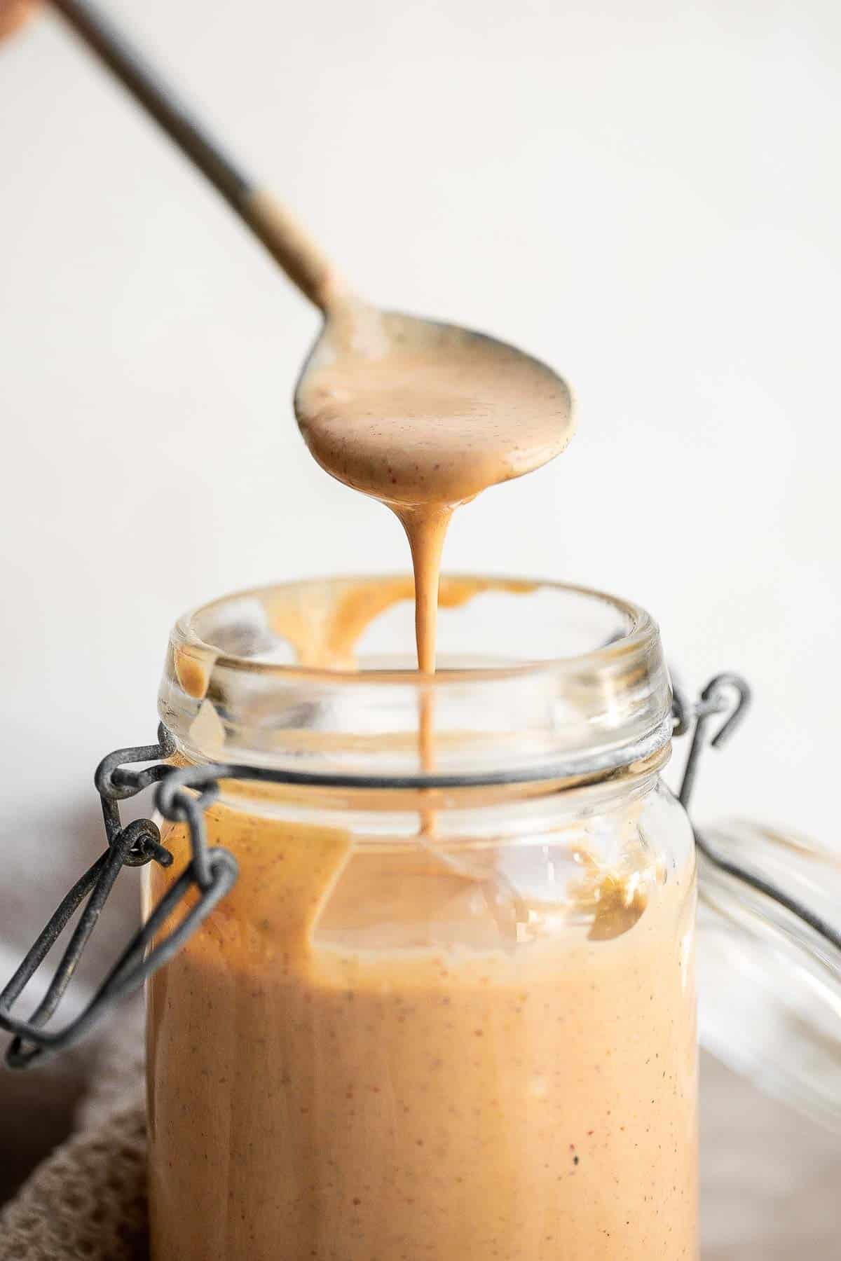 Homemade Southwest Salad Dressing is creamy and flavorful with a little spicy kick. This quick and easy yogurt-based dressing is ready in just minutes. | aheadofthyme.com