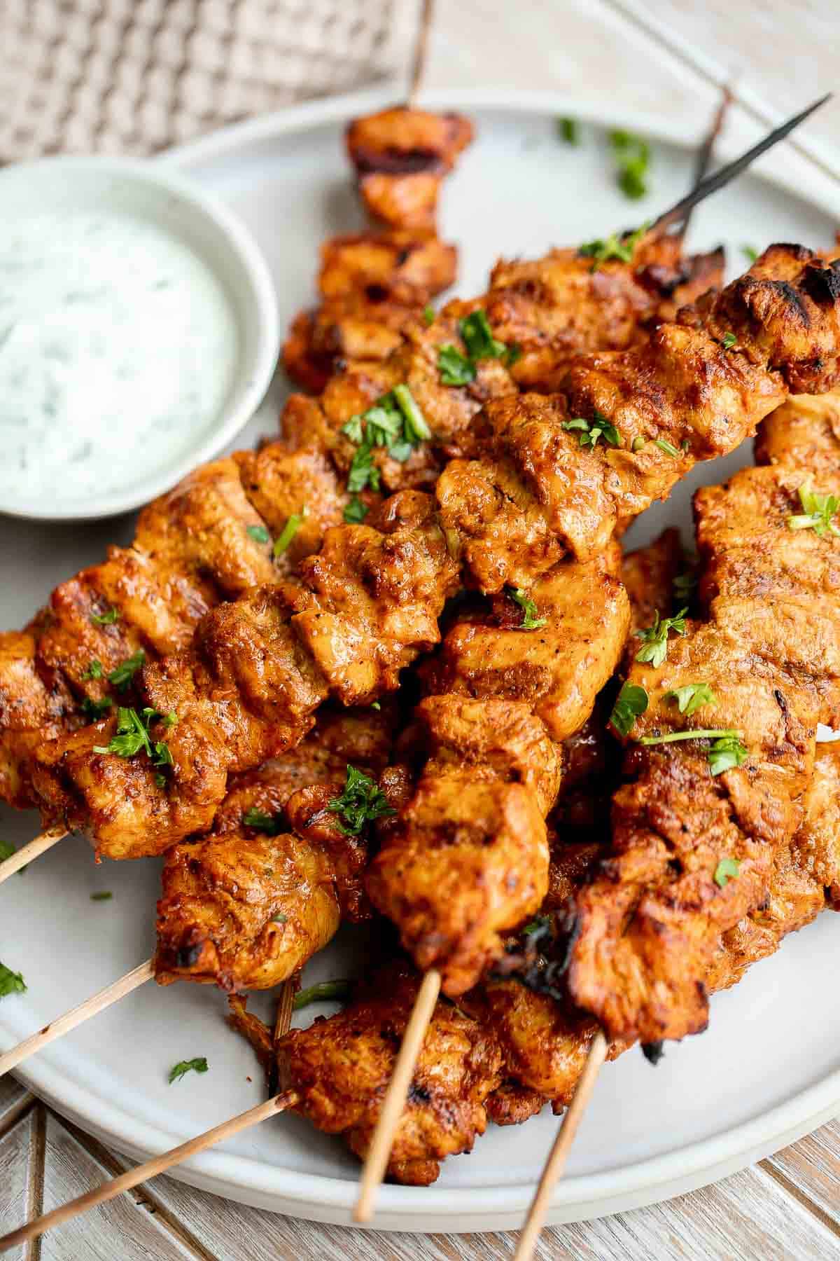 Tandoori Chicken Skewers with juicy tender chicken bites are marinated in an authentic yogurt marinade packed with a homemade Indian seasoning blend. | aheadofthyme.com