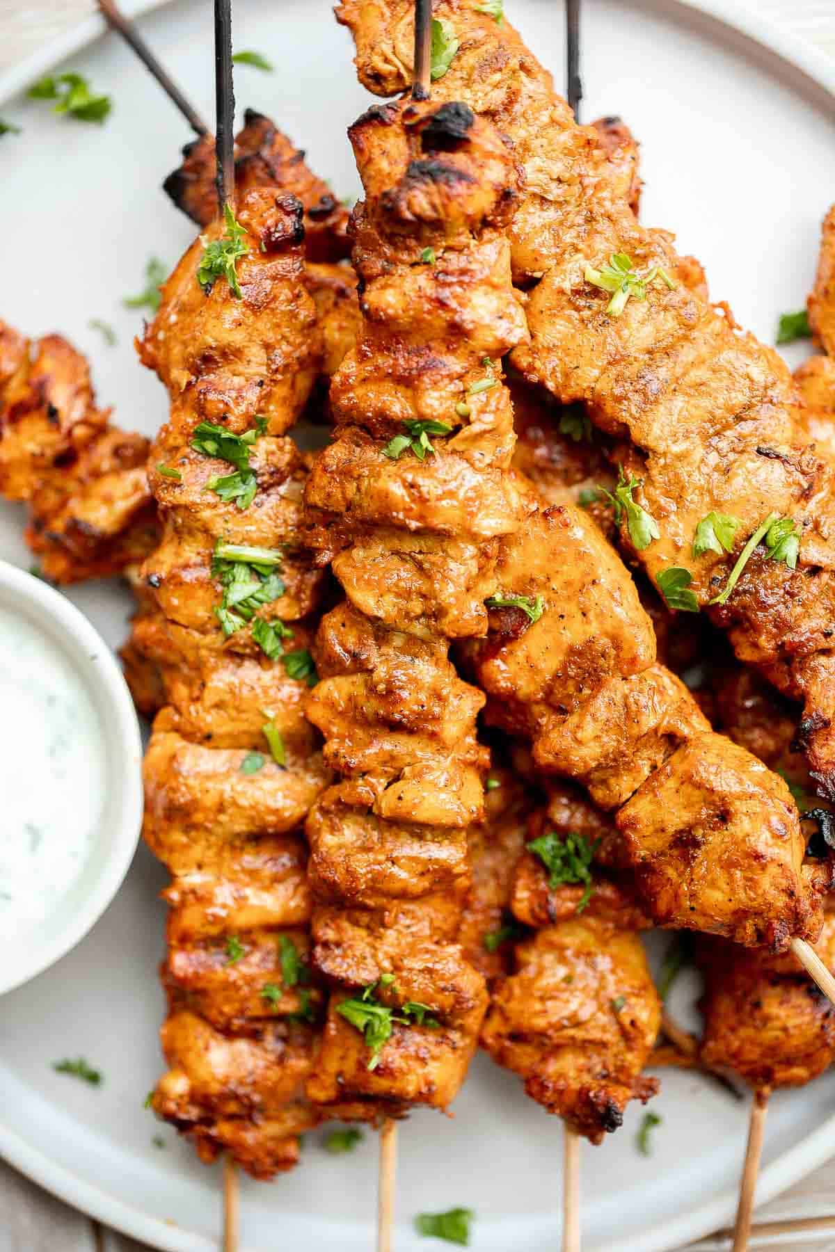 Tandoori Chicken Skewers with juicy tender chicken bites are marinated in an authentic yogurt marinade packed with a homemade Indian seasoning blend. | aheadofthyme.com