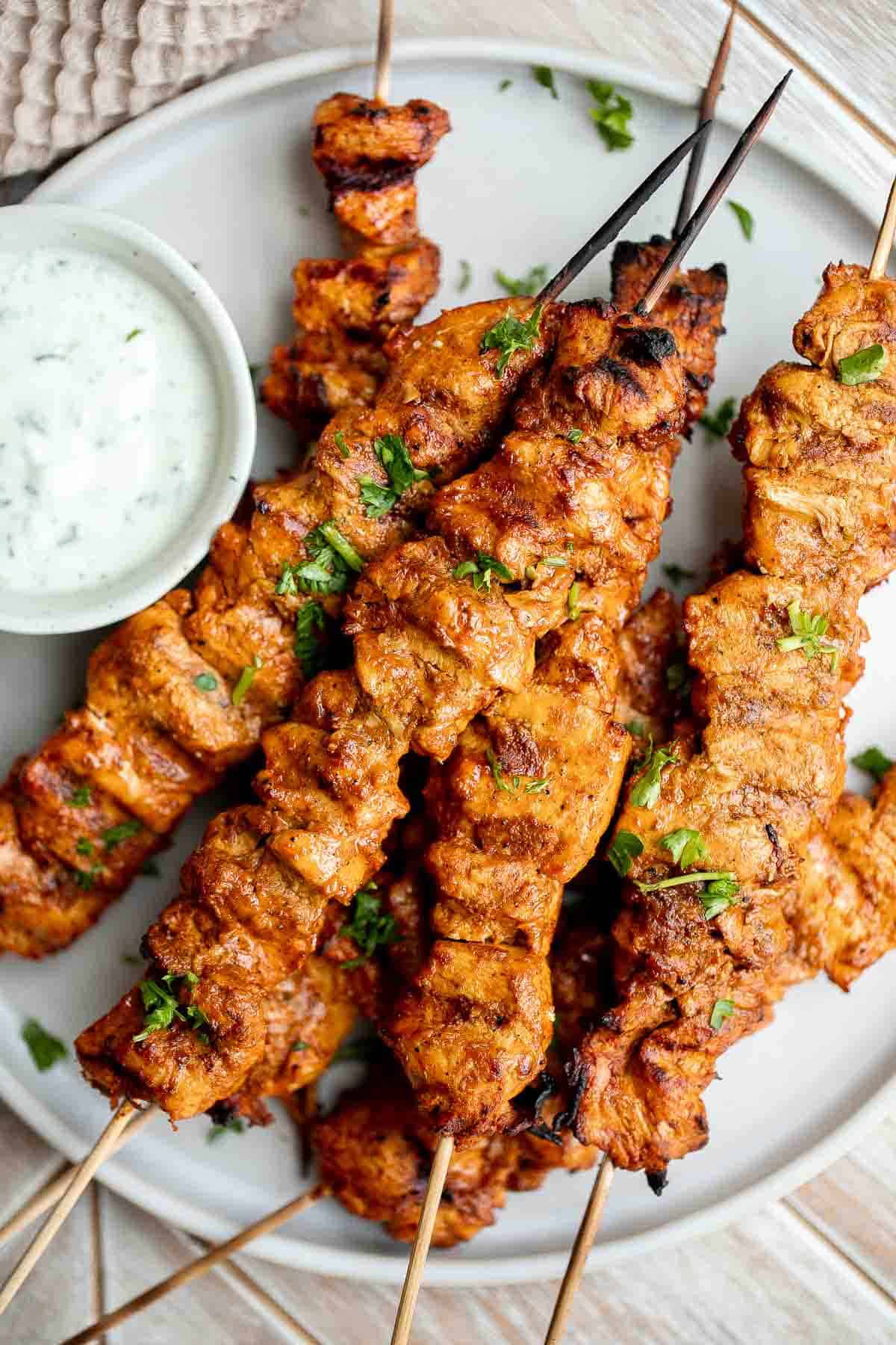 Tandoori Chicken Skewers with juicy tender chicken bites are marinated in an authentic yogurt marinade packed with a homemade Indian seasoning blend. | aheadofthyme.com